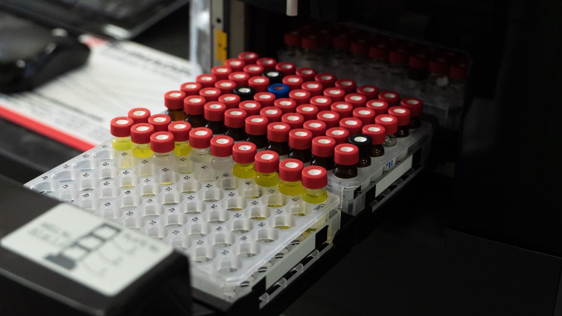Rack of capped sample vials loaded in a laboratory autosampler